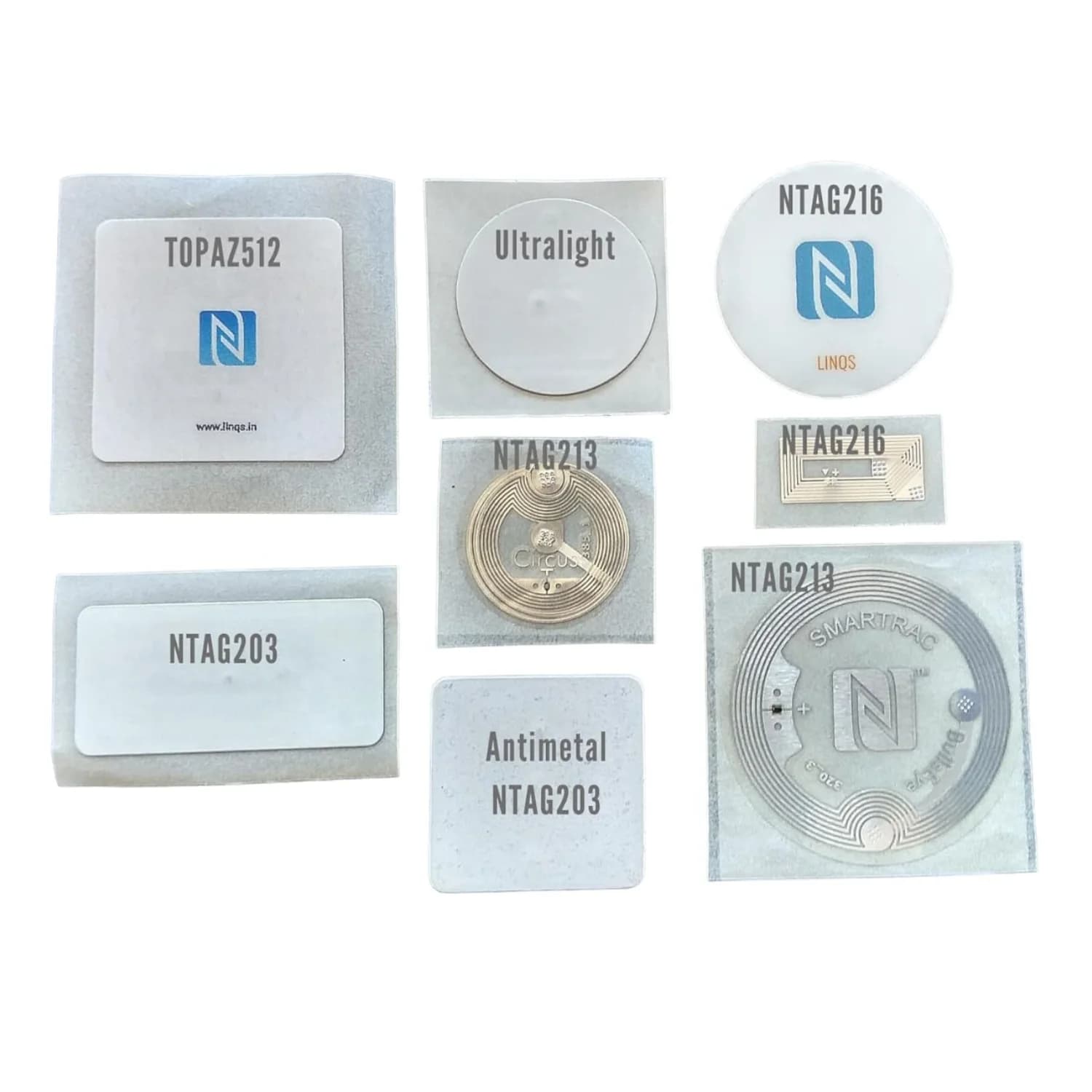 Assorted NFC stickers with various chip labels on a white background.