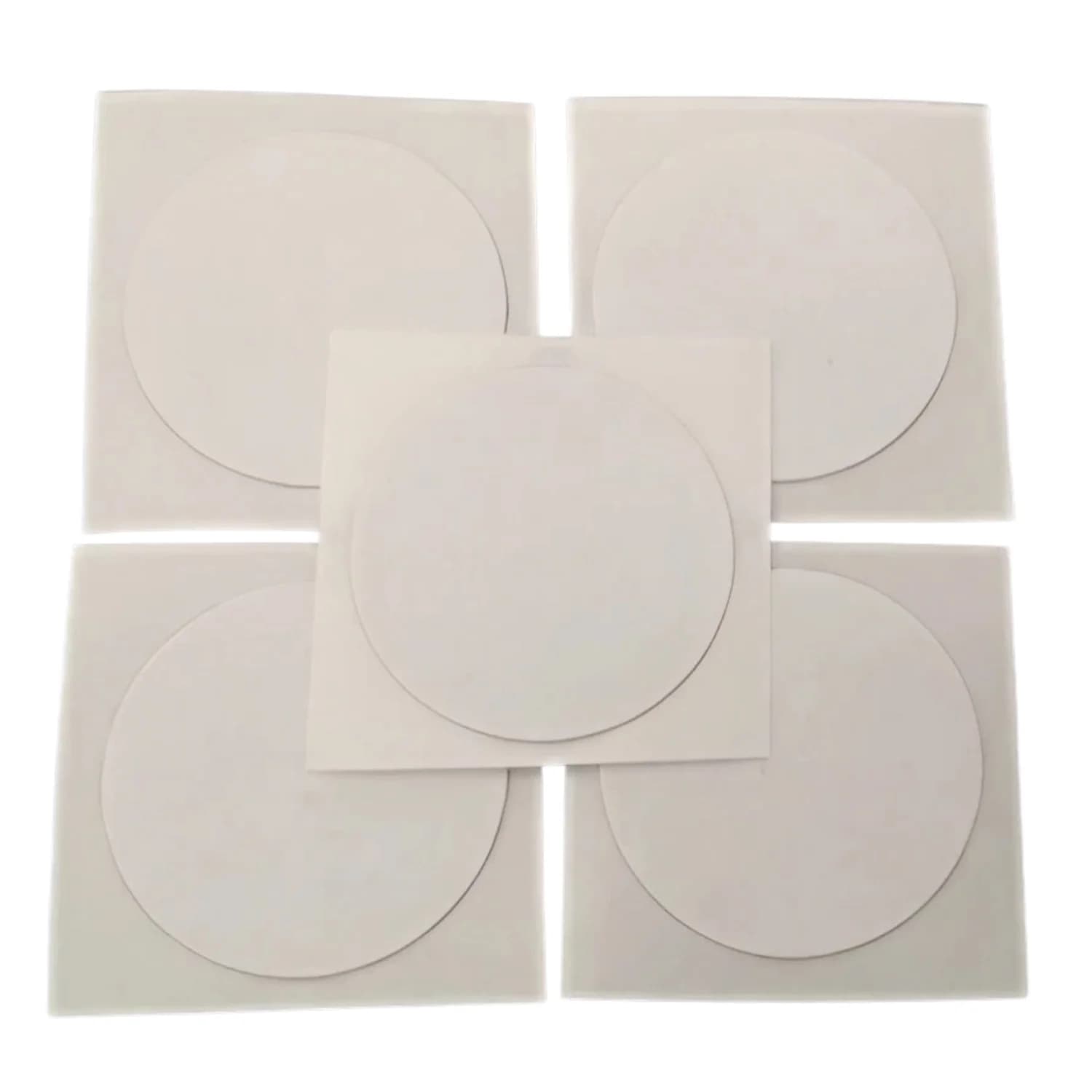 Five white circular NFC stickers arranged in a cross pattern on a white background.