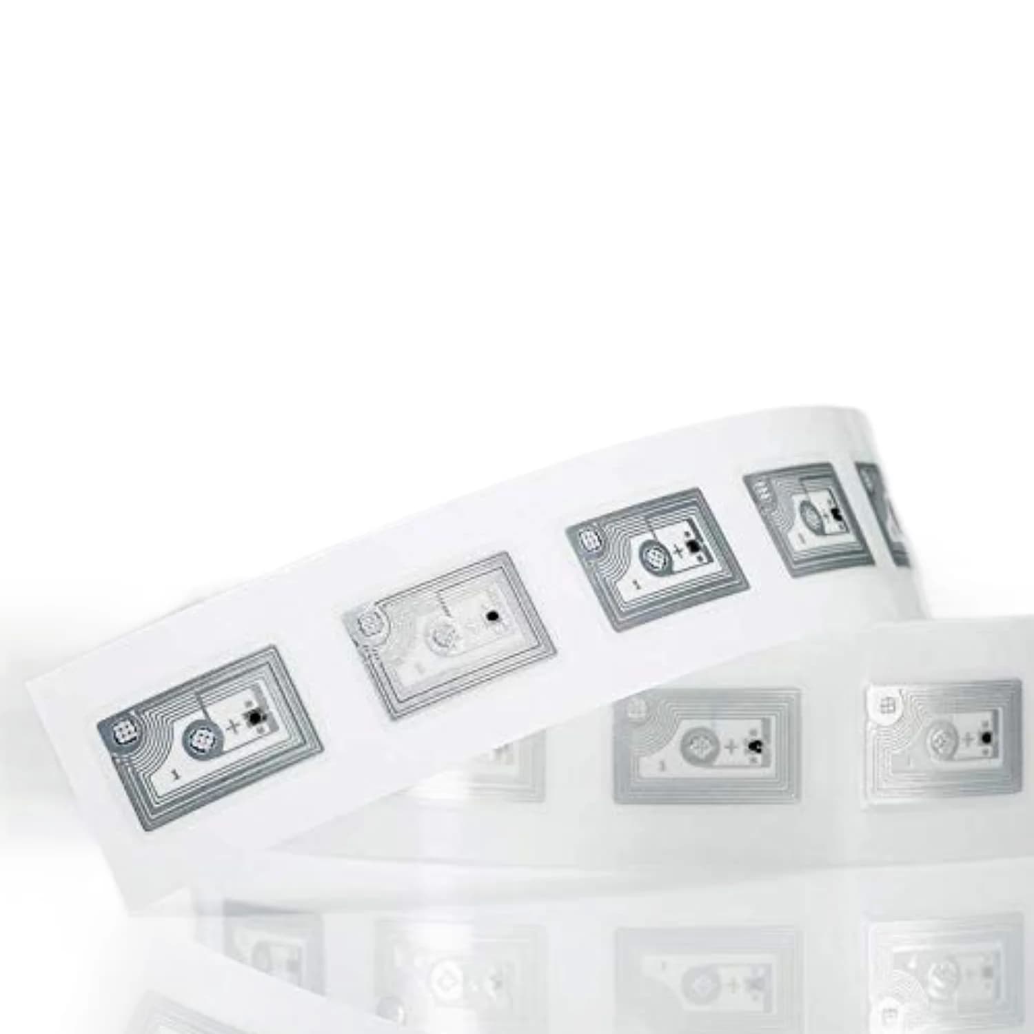 A roll of transparent NFC stickers with visible circuitry patterns on a white background.