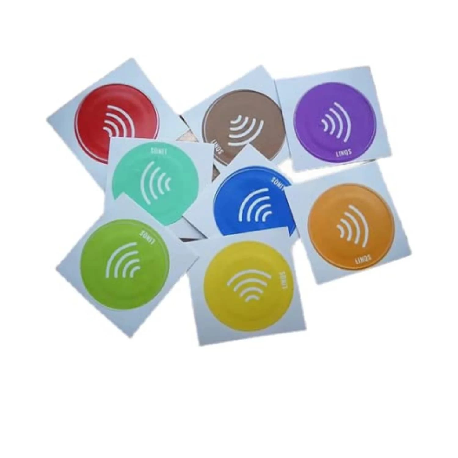 Colorful round NFC stickers with "NFC" text and wave symbols, arranged on a white surface.