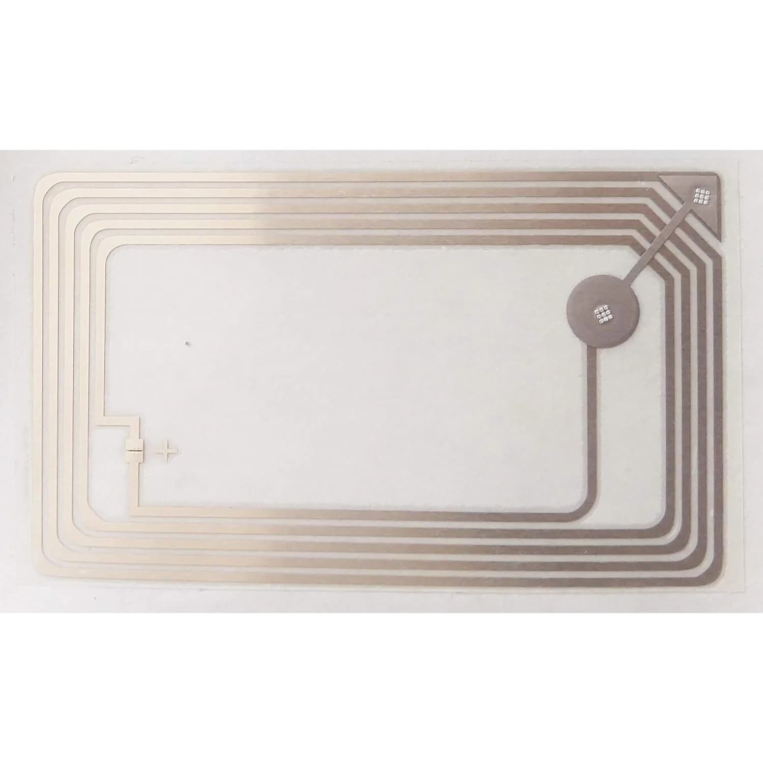 A rectangular NFC sticker with visible circuitry on a white background.