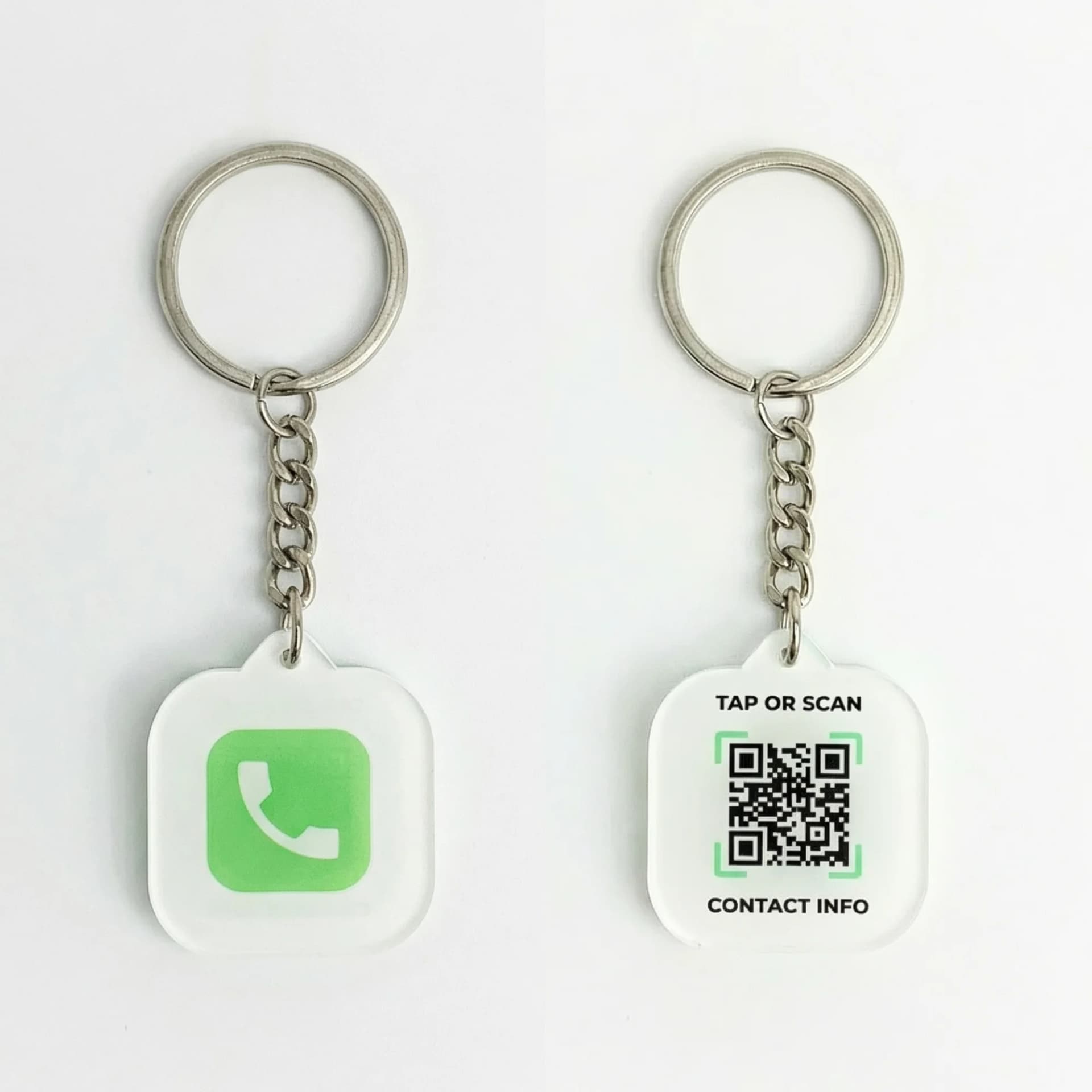 A silver keychain with a white square tag displaying a green WhatsApp icon on one side and a QR code with "TAP OR SCAN CONTACT INFO" on the other side.