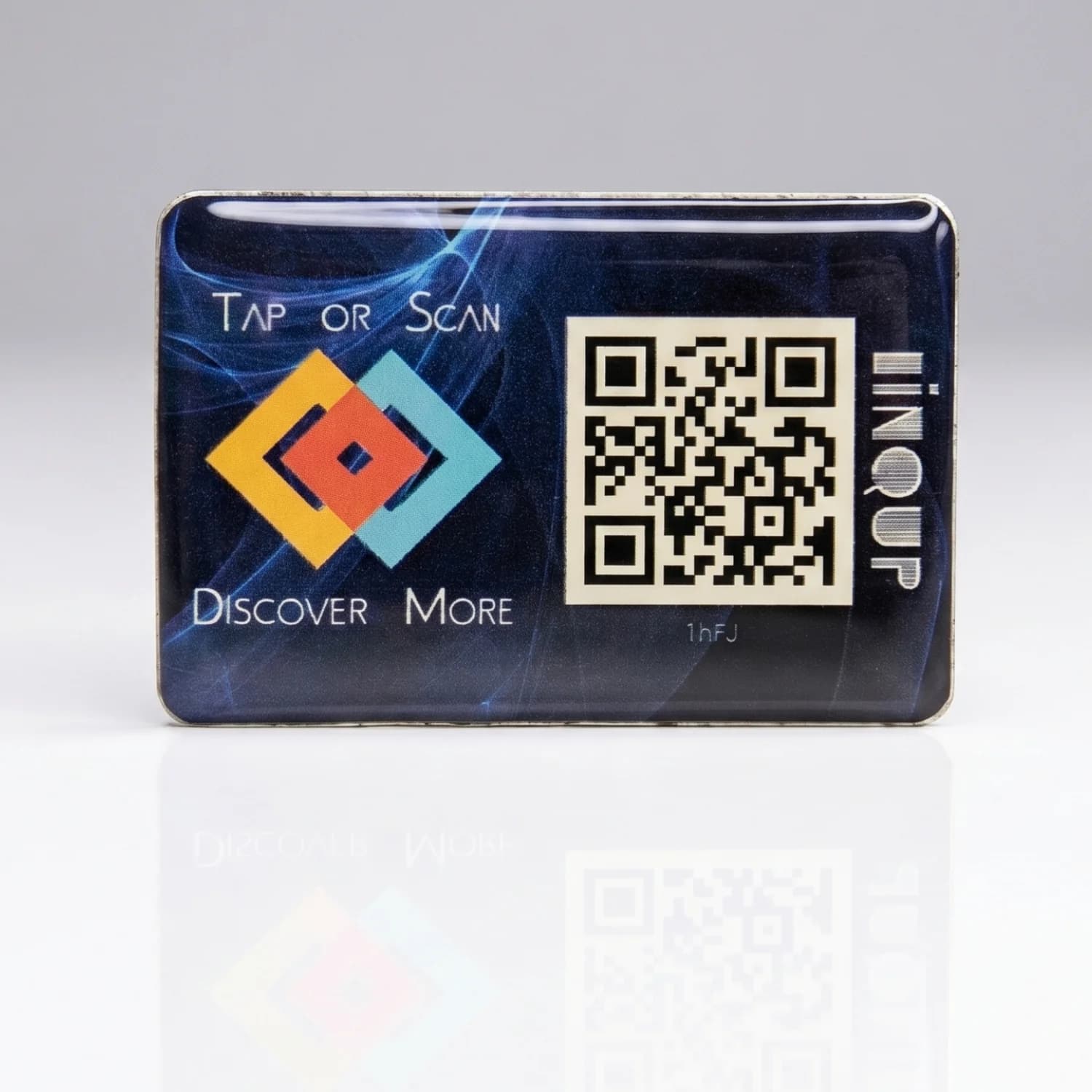 Front view of LINQS Smart NFC and QR dynamic sticker on a reflective surface