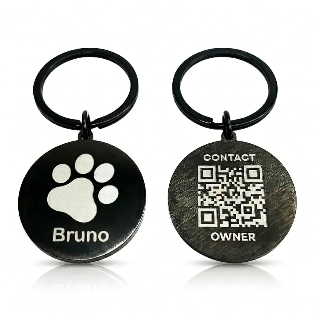 Black stainless steel pet ID tag with a paw print and the name "Bruno" on one side, and a QR code with "CONTACT OWNER" on the other side, attached to a black keyring.