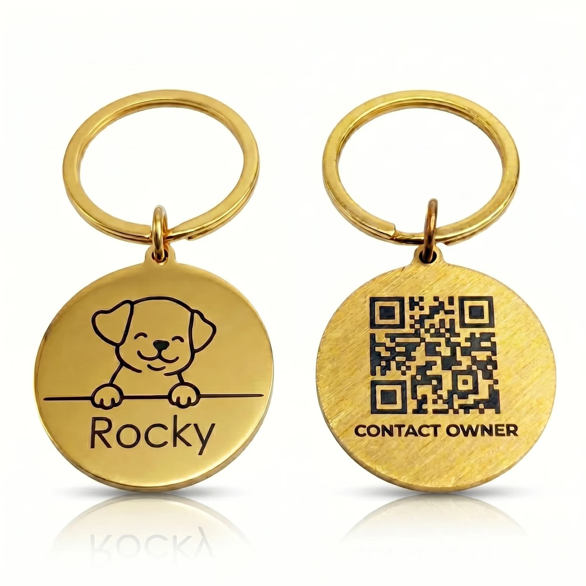 Golden stainless steel pet ID tags with engraved designs and QR codes hanging on metal rings against a white background.