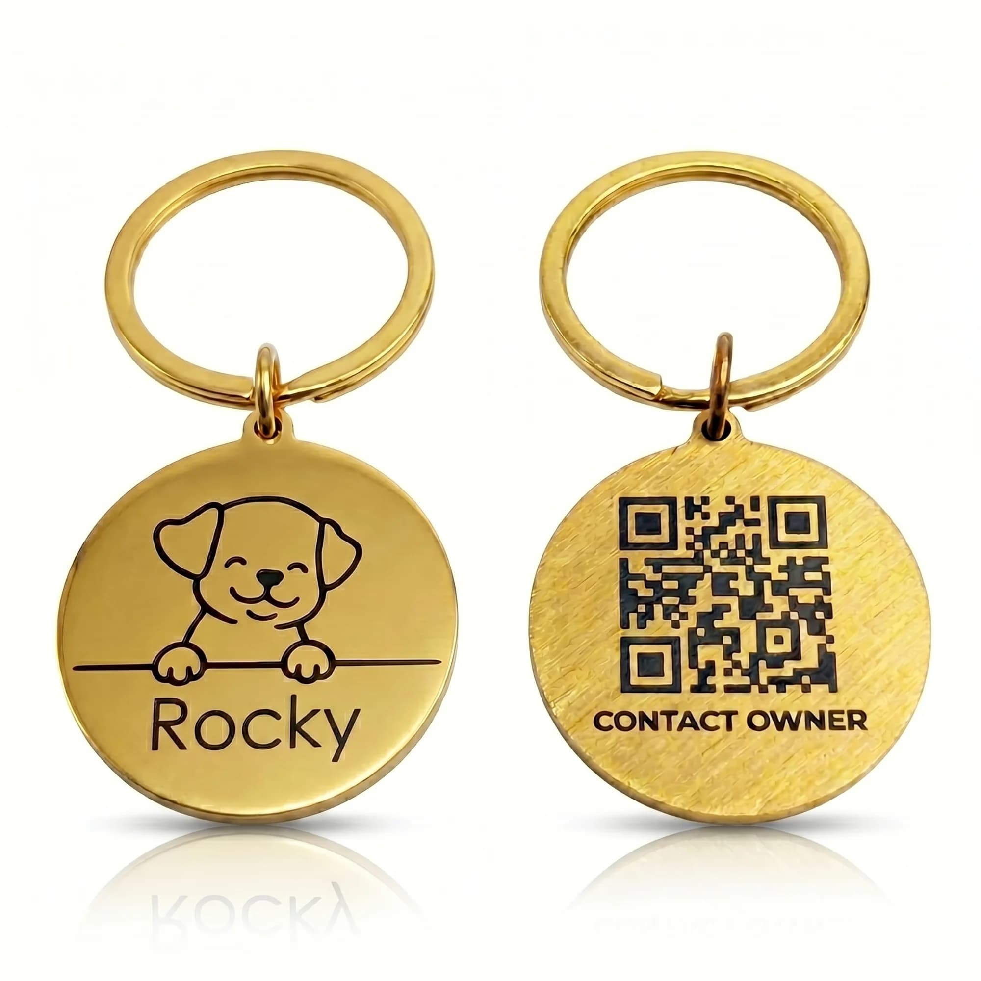Golden stainless steel pet ID tags with engraved designs and QR codes hanging on metal rings against a white background.