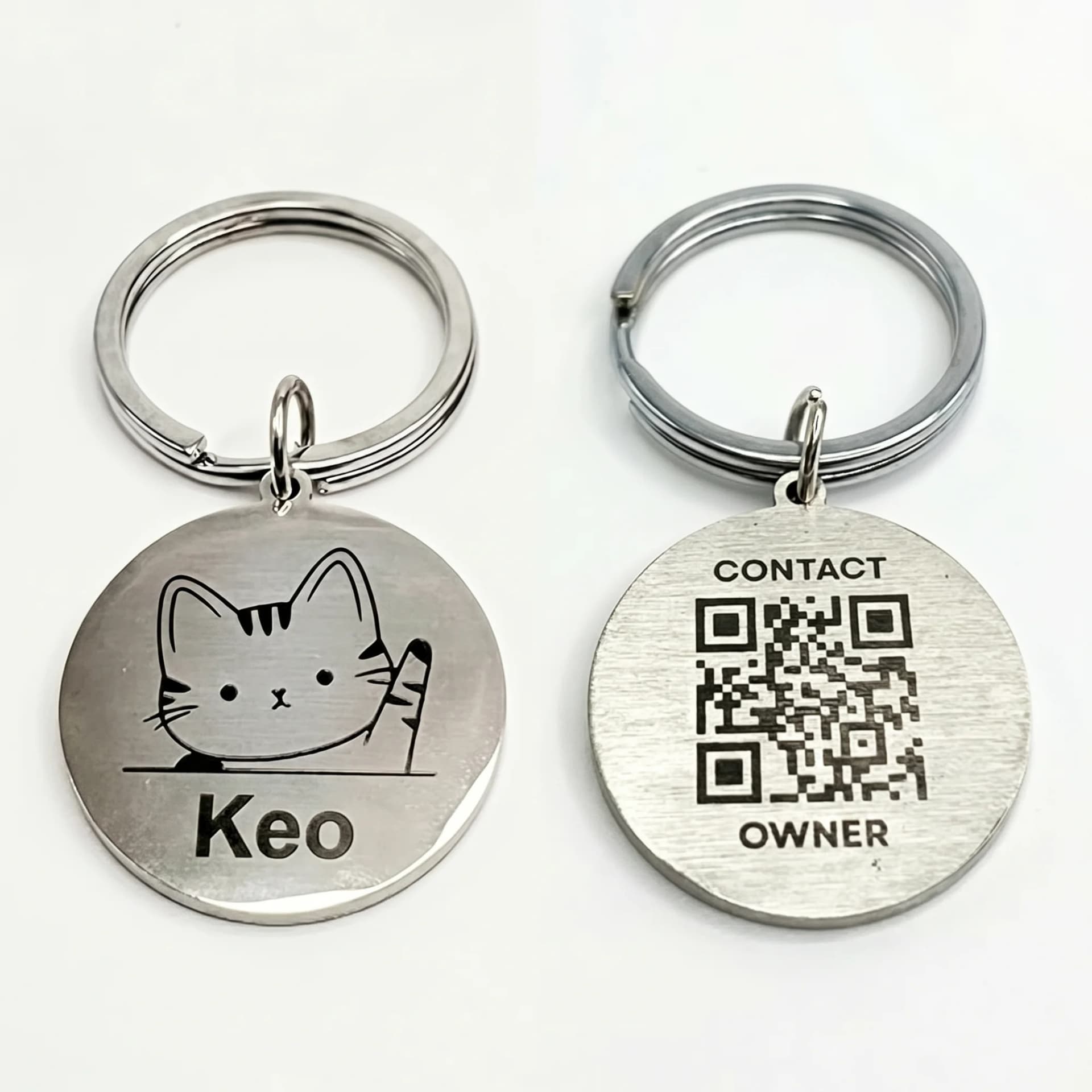 Silver round pet ID tags with engraved designs, QR codes, and contact information on a white background.